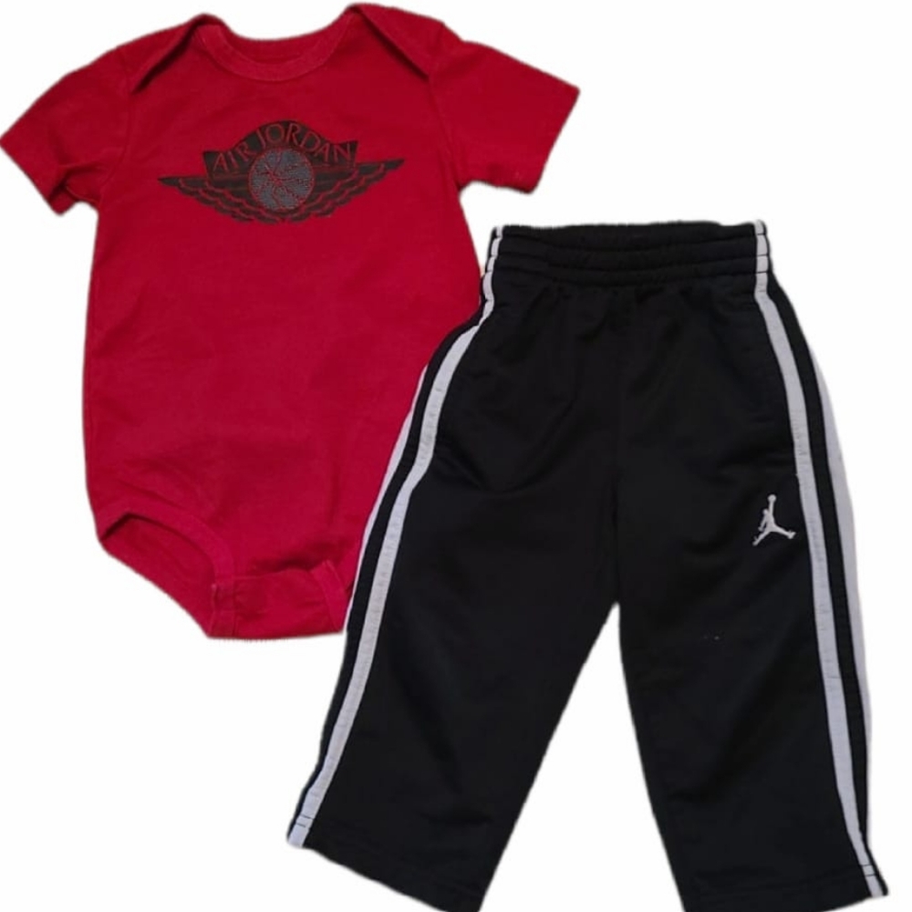 Air Jordan red onesie/bodysuit and black athletic track pants
